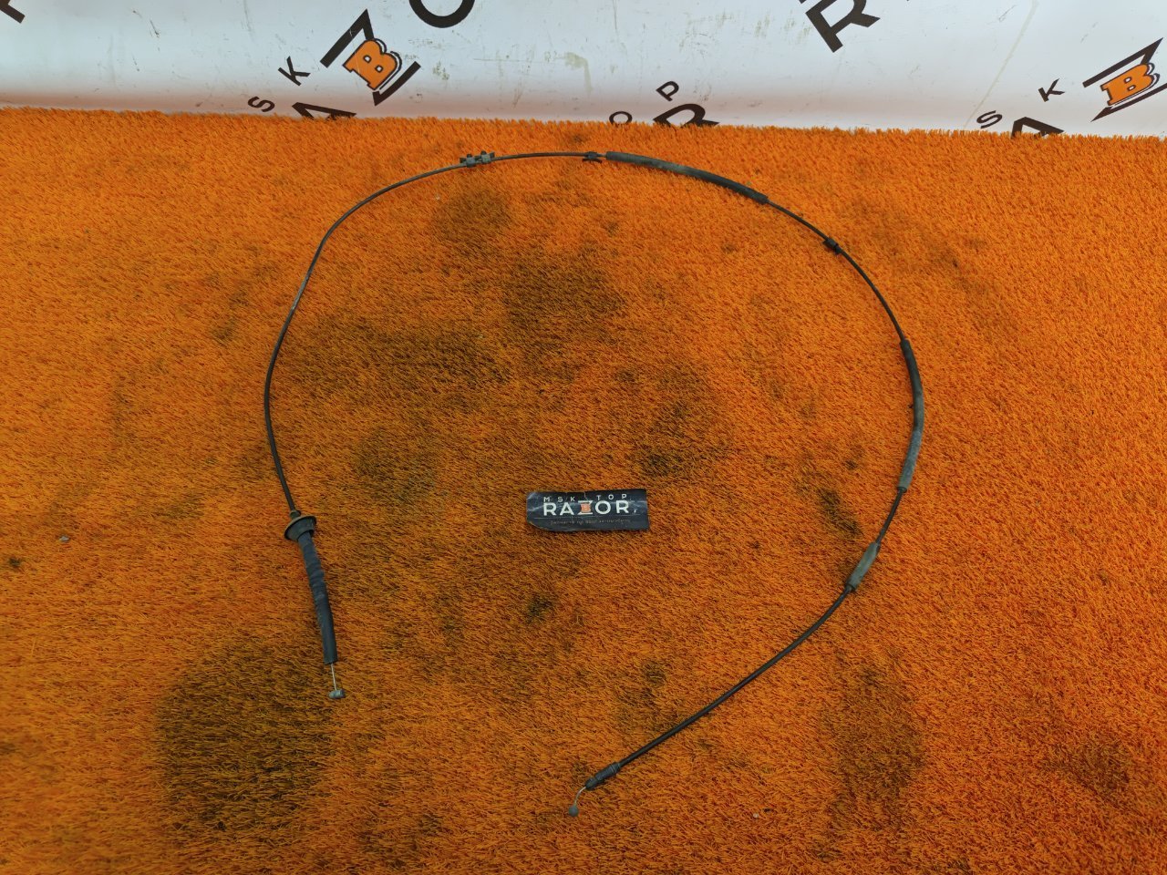 Трос замка капота